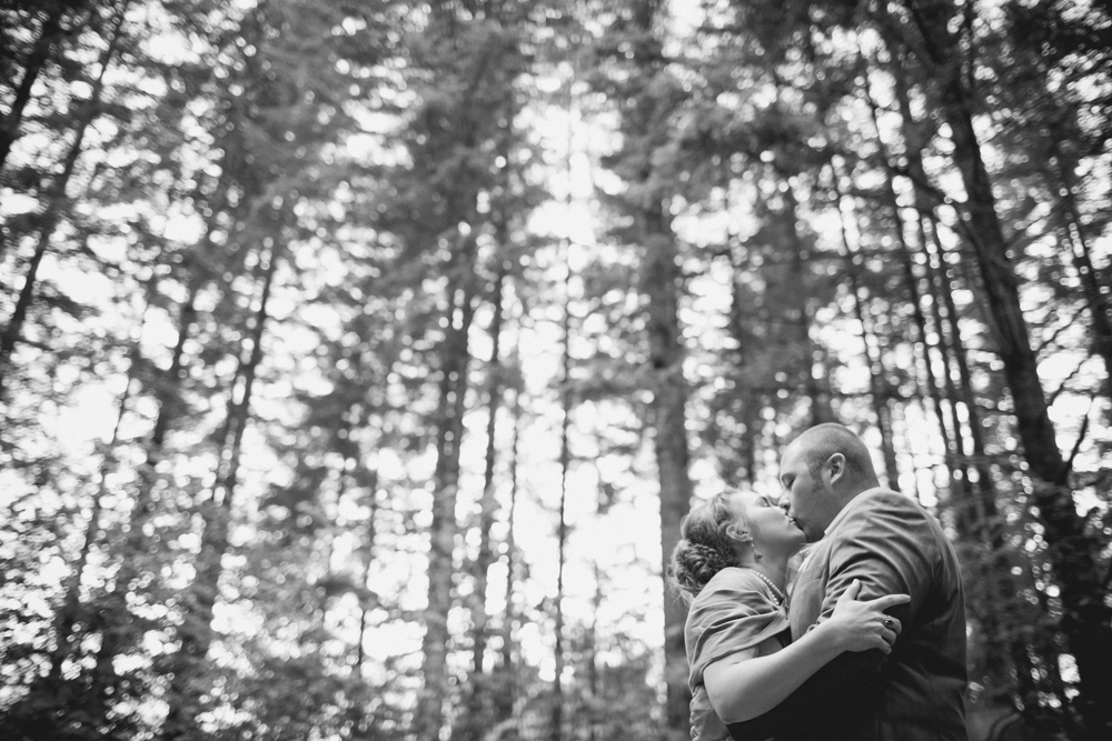 Two photos of a young couple outdoors in autumn: on the left, they stand close together, smiling, surrounded by fallen leaves; on the right, the woman playfully rides on the man's back among rocks and greenery. Jessica Hill Photography