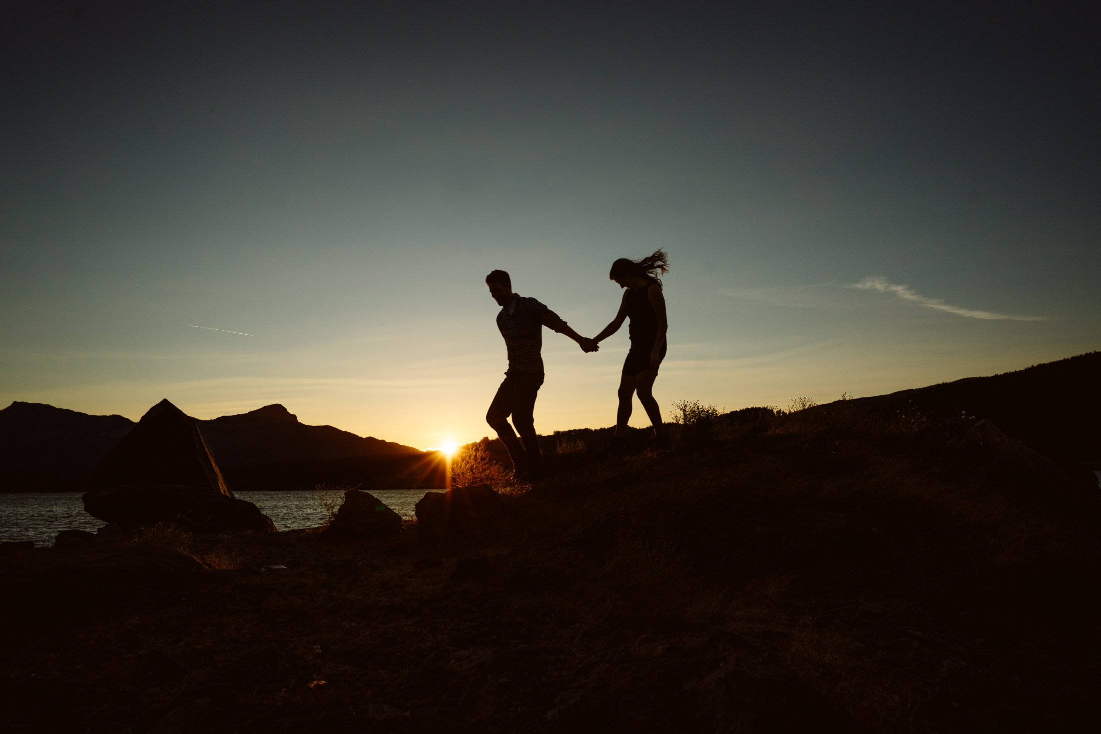 Couple holding hands during sunset walk