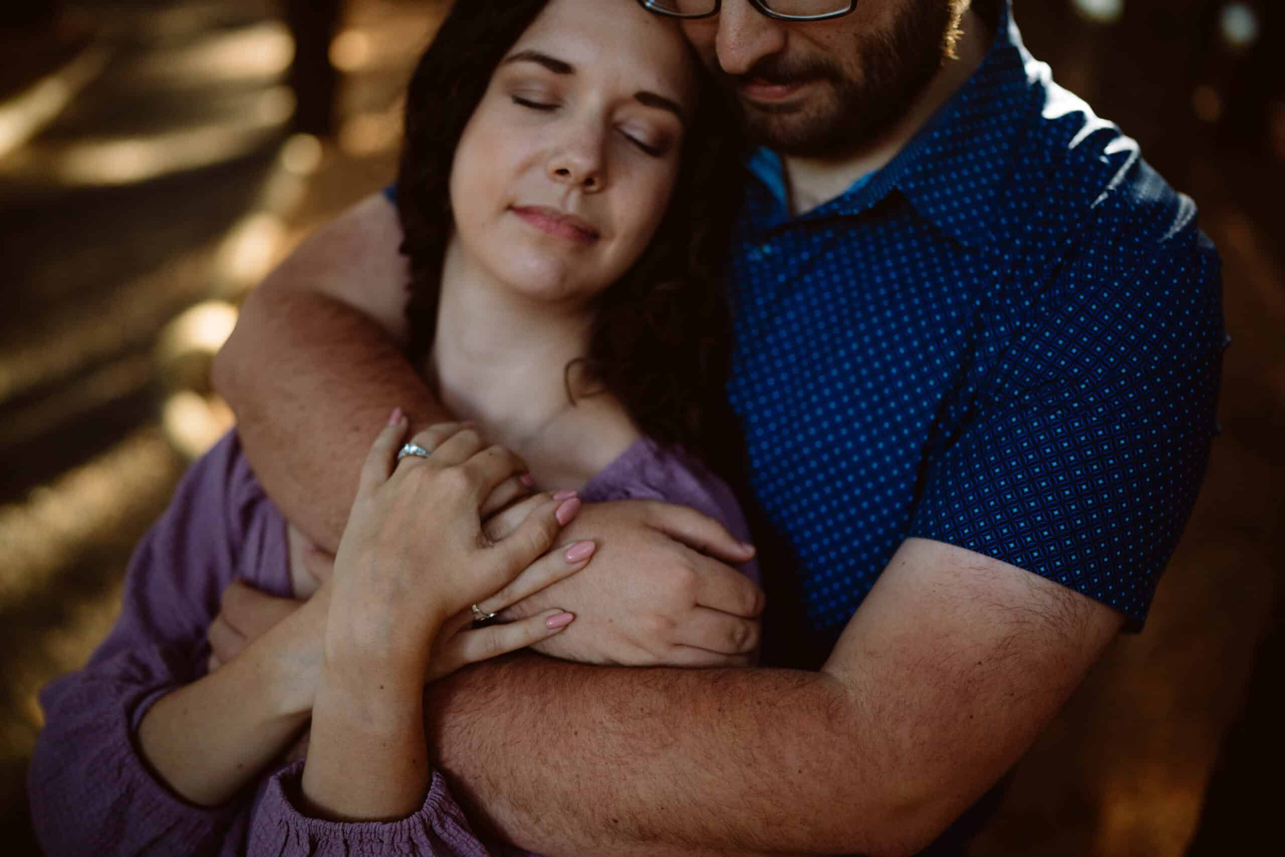 Couple embracing peacefully in sunlight