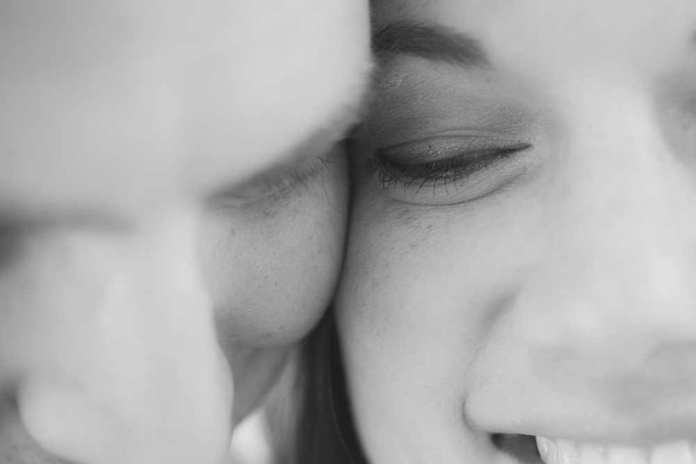 Close-up black and white photo of two people’s faces, both smiling, with their foreheads touching and eyes closed. Jessica Hill Photography - Wedding Photographer - Oregon
