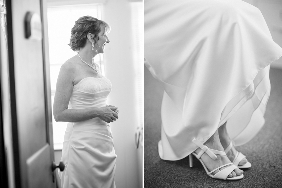 A woman in a strapless wedding dress stands by a window; close-up of her feet in white heeled sandals under her gown. Jessica Hill Photography - Wedding Photographer - Oregon