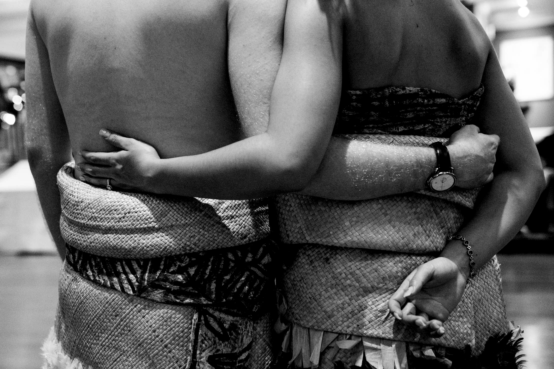Two people embracing in traditional attire
