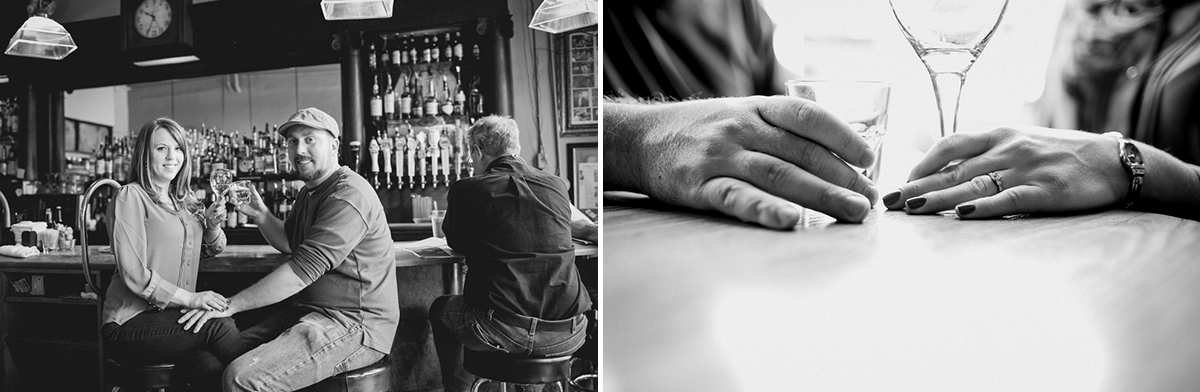 A couple sits together at a bar while another man sits nearby; close-up shot shows their hands with drinks and an engagement ring. Jessica Hill Photography - Wedding Photographer - Oregon