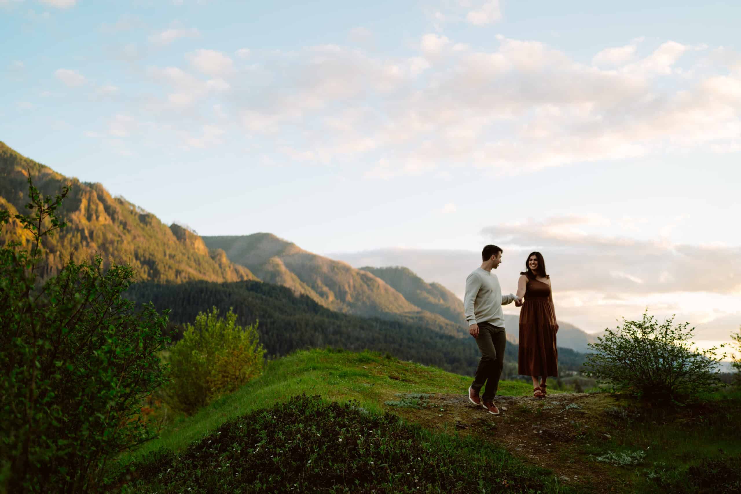 Couple walking on scenic mountain path